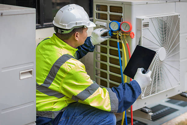 Professional Air Conditioning Repair technician working in Hurley, WI